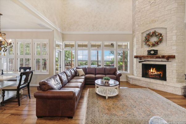 Chandelier, Dining room, Fireplace, Interior, Living room, Stone Walls, Wood Texture Flooring