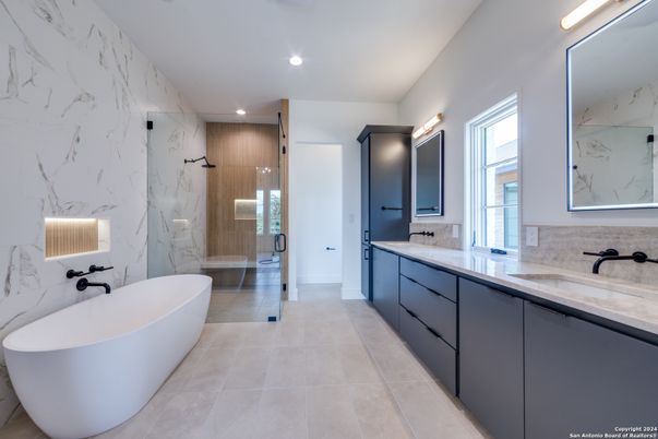 Bathroom, Dual Sink Vanities, Free Standing Baths, Glass Shower, Interior, Marble Walls, Recessed Lighting
