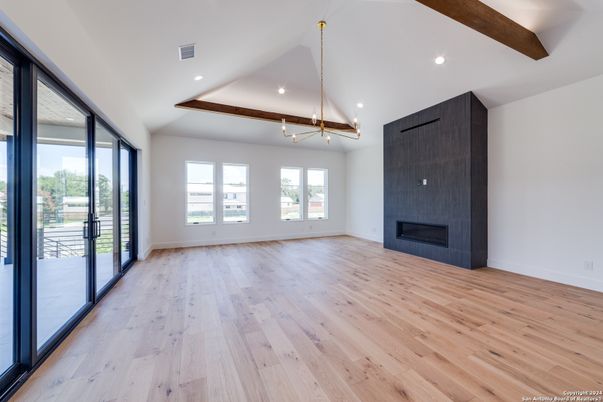 Empty room, Fireplace, Interior, Pendant Lights, Recessed Lighting, Wooden Beams, Wood Texture Flooring