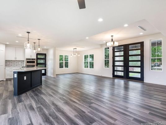 Chandelier, Interior, Kitchen, Pendant Lights, Recessed Lighting, Stainless Steel Appliances, Wood Texture Flooring