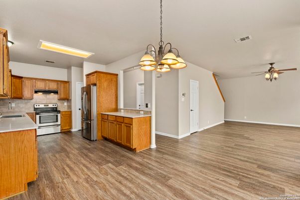 Chandelier, Interior, Kitchen, Pendant Lights, Stainless Steel Appliances, Wood Texture Flooring