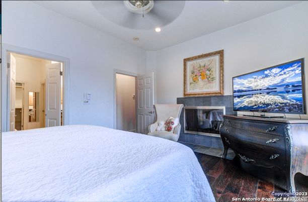 Bedroom, Fireplace, Interior, Recessed Lighting, Wood Texture Flooring