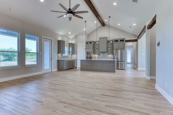 Empty room, Interior, Kitchen, Pendant Lights, Recessed Lighting, Stainless Steel Appliances, Wooden Beams, Wood Texture Flooring