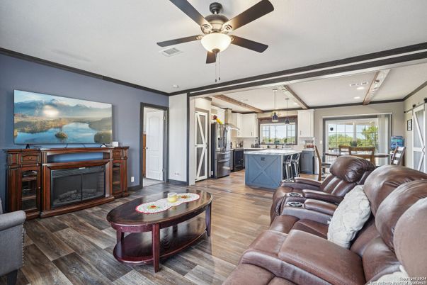 Fireplace, Interior, Kitchen, Living room, Pendant Lights, Recessed Lighting, Stainless Steel Appliances, Wood Texture Flooring
