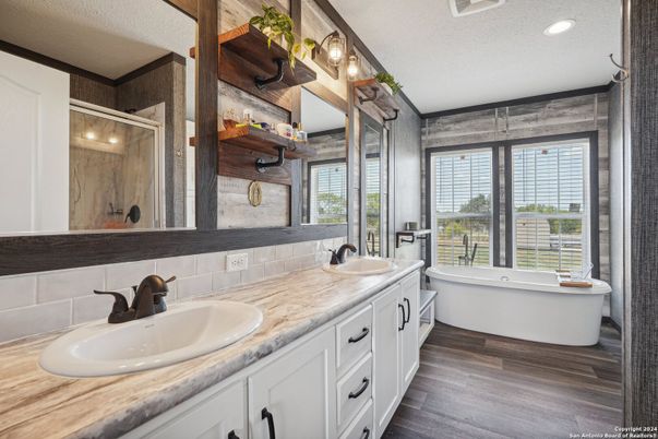 Bathroom, Dual Sink Vanities, Free Standing Baths, Interior, Recessed Lighting, Wood Texture Flooring