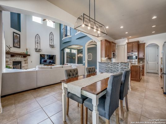 Dining room, Fireplace, Interior, Kitchen, Living room, Pendant Lights, Recessed Lighting, Stainless Steel Appliances