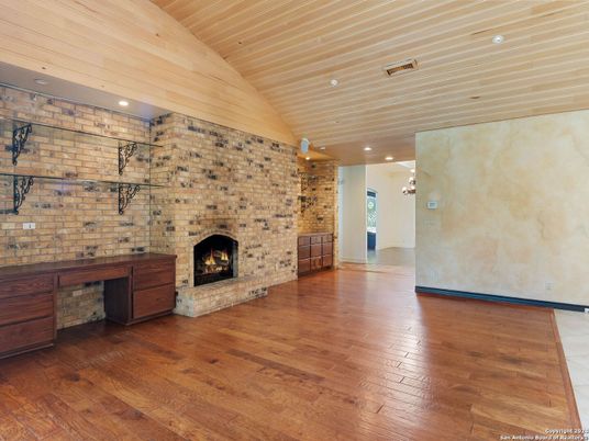 Empty room, Fireplace, Interior, Recessed Lighting, Stone Walls, Wooden Ceilings, Wood Texture Flooring