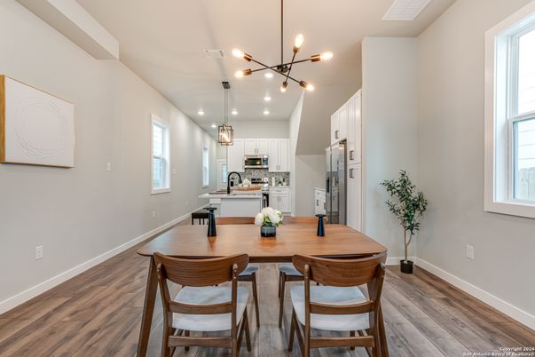 Dining room, Interior, Kitchen, Pendant Lights, Recessed Lighting, Stainless Steel Appliances, Wood Texture Flooring