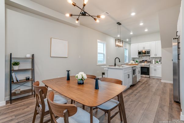 Dining room, Interior, Kitchen, Pendant Lights, Recessed Lighting, Stainless Steel Appliances, Wood Texture Flooring