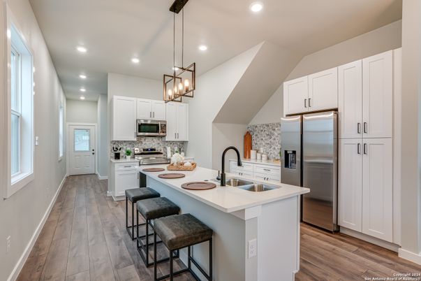 Interior, Kitchen, Pendant Lights, Recessed Lighting, Stainless Steel Appliances, Wood Texture Flooring