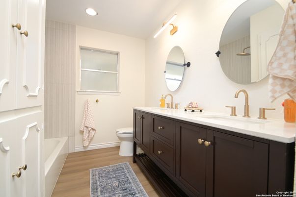Bathroom, Dual Sink Vanities, Interior, Recessed Lighting, Wood Texture Flooring