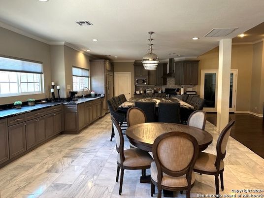 Dining room, Interior, Kitchen, Pendant Lights, Recessed Lighting, Stainless Steel Appliances, Wood Texture Flooring