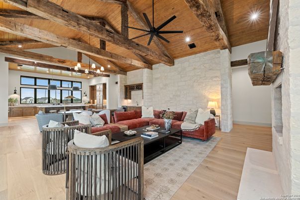 Chandelier, Dining room, Fireplace, Interior, Kitchen, Living room, Pendant Lights, Recessed Lighting, Stone Walls, Wooden Beams, Wooden Ceilings, Wood Texture Flooring
