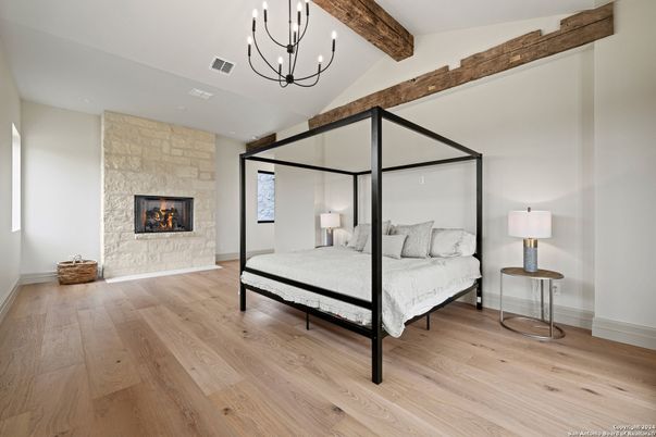 Bedroom, Chandelier, Fireplace, Interior, Stone Walls, Wooden Beams, Wood Texture Flooring