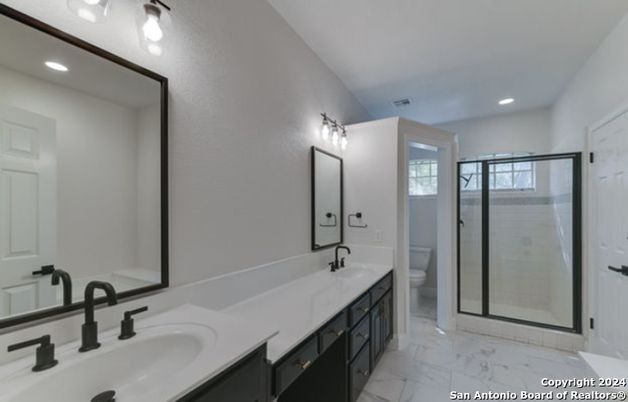 Bathroom, Dual Sink Vanities, Glass Shower, Interior, Marble, Recessed Lighting