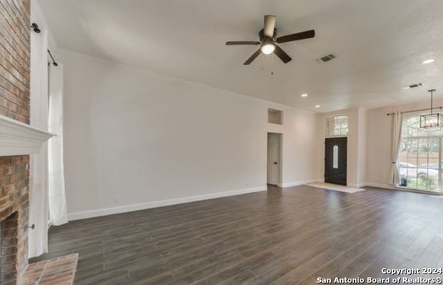 Empty room, Fireplace, Interior, Pendant Lights, Recessed Lighting, Stone Walls, Wood Texture Flooring