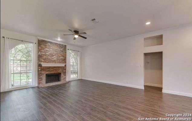 Empty room, Fireplace, Interior, Recessed Lighting, Stone Walls, Wood Texture Flooring