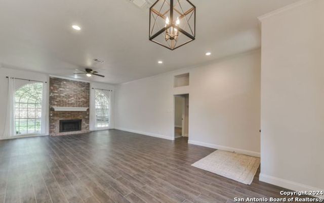 Empty room, Fireplace, Interior, Pendant Lights, Recessed Lighting, Stone Walls, Wood Texture Flooring