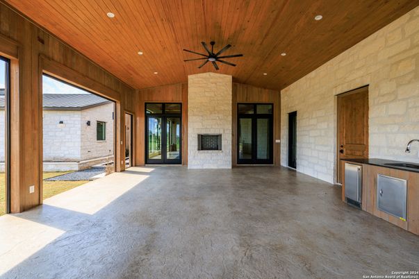 Exterior, Fireplace, Recessed Lighting, Stone Walls, Wooden Ceilings