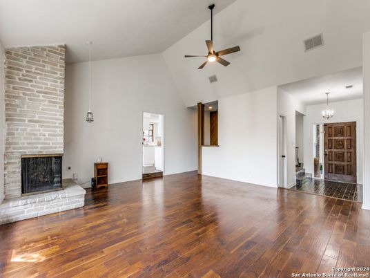 Chandelier, Empty room, Fireplace, Interior, Stone Walls, Wood Texture Flooring