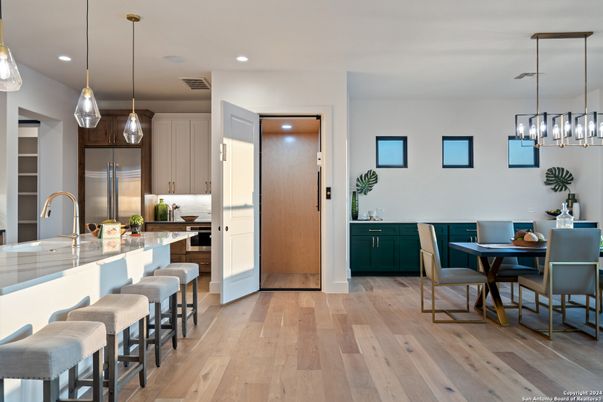 Dining room, Interior, Kitchen, Pendant Lights, Recessed Lighting, Stainless Steel Appliances, Wood Texture Flooring