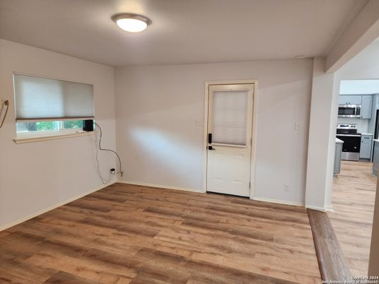 Empty room, Interior, Kitchen, Stainless Steel Appliances, Wood Texture Flooring