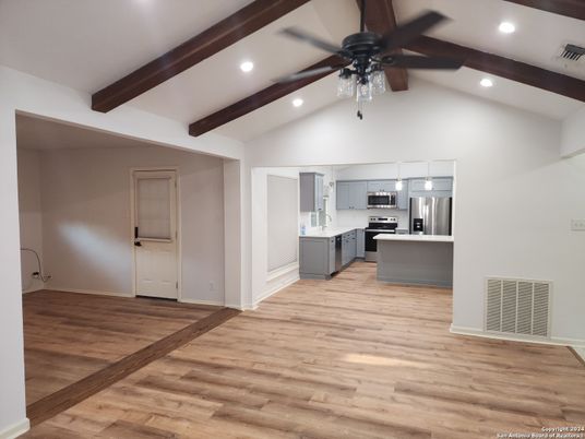 Empty room, Interior, Kitchen, Recessed Lighting, Stainless Steel Appliances, Wooden Beams, Wood Texture Flooring