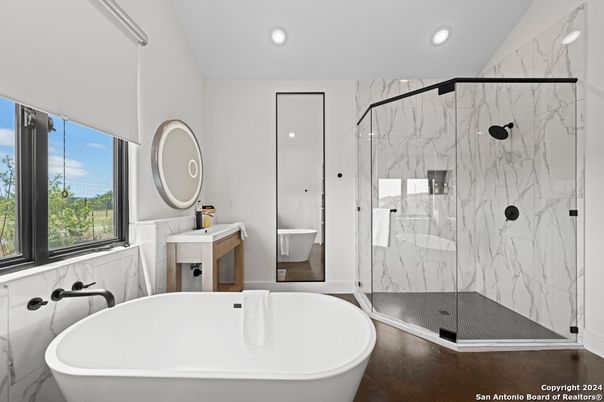Bathroom, Free Standing Baths, Glass Shower, Interior, Marble Walls, Recessed Lighting