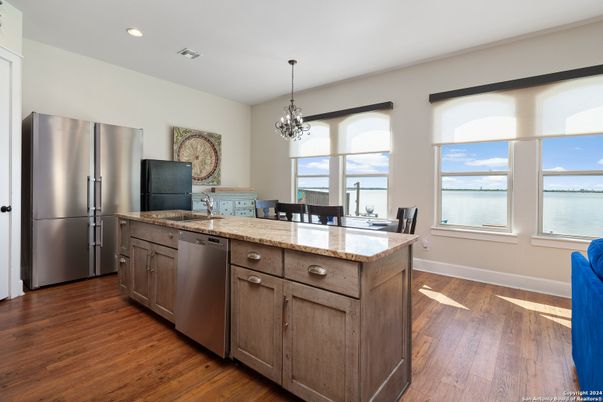 Chandelier, Dining room, Interior, Kitchen, Recessed Lighting, Stainless Steel Appliances, Water, Wood Texture Flooring