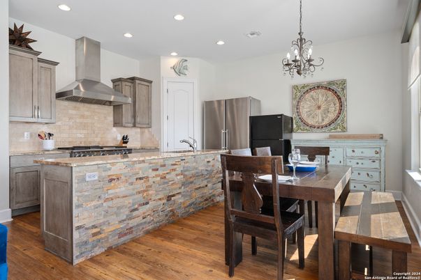 Chandelier, Dining room, Interior, Kitchen, Recessed Lighting, Stainless Steel Appliances, Wood Texture Flooring