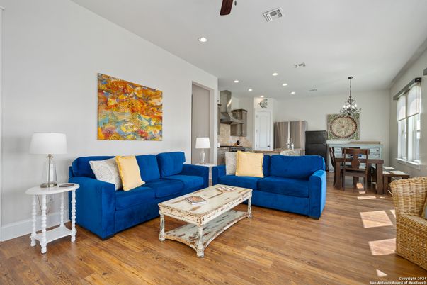 Chandelier, Dining room, Interior, Kitchen, Living room, Pendant Lights, Recessed Lighting, Stainless Steel Appliances, Wood Texture Flooring