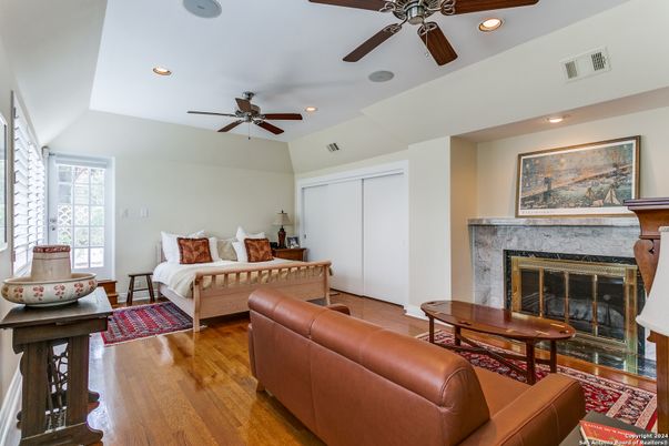 Bedroom, Fireplace, Interior, Recessed Lighting, Wood Texture Flooring
