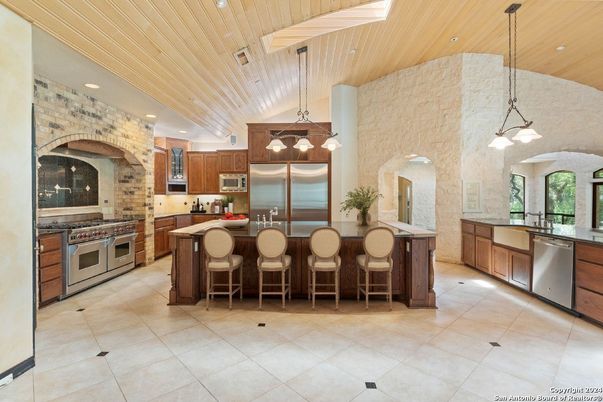 Interior, Kitchen, Pendant Lights, Recessed Lighting, Stainless Steel Appliances, Stone Walls, Wooden Ceilings