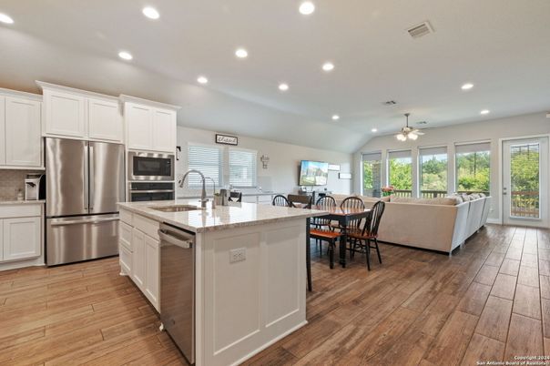 Dining room, Interior, Kitchen, Living room, Recessed Lighting, Stainless Steel Appliances, Wood Texture Flooring