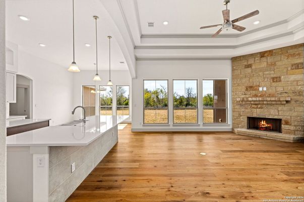 Fireplace, Interior, Kitchen, Pendant Lights, Recessed Lighting, Stone Walls, Wood Texture Flooring