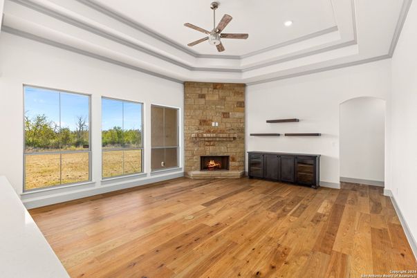 Empty room, Fireplace, Interior, Recessed Lighting, Stone Walls, Wood Texture Flooring