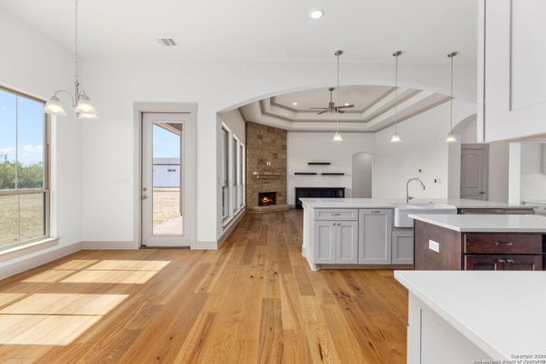 Fireplace, Interior, Kitchen, Pendant Lights, Recessed Lighting, Stone Walls, Wood Texture Flooring