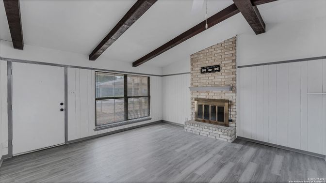 Empty room, Fireplace, Interior, Stone Walls, Wooden Beams, Wood Texture Flooring