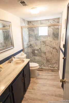 Bathroom, Glass Shower, Interior, Marble Walls, Wood Texture Flooring