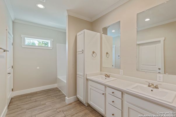 Bathroom, Dual Sink Vanities, Interior, Recessed Lighting, Wood Texture Flooring