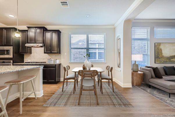 Dining room, Interior, Kitchen, Pendant Lights, Recessed Lighting, Stainless Steel Appliances, Wood Texture Flooring