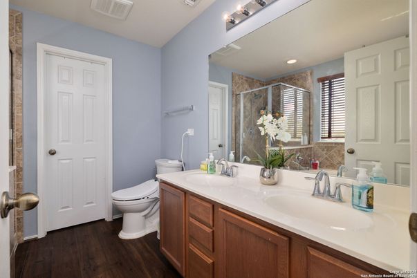 Bathroom, Dual Sink Vanities, Glass Shower, Interior, Recessed Lighting, Wood Texture Flooring
