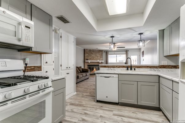Fireplace, Interior, Kitchen, Living room, Pendant Lights, Stone Walls, Wood Texture Flooring