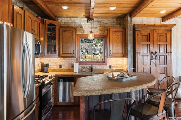 Interior, Kitchen, Pendant Lights, Recessed Lighting, Stainless Steel Appliances, Stone Walls, Wooden Beams, Wooden Ceilings, Wood Texture Flooring