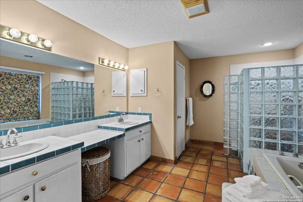Bathroom, Dual Sink Vanities, Interior, Recessed Lighting, Tile Countertops
