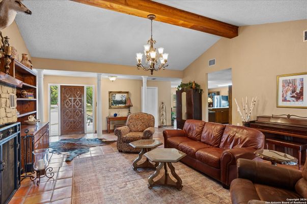 Chandelier, Fireplace, Interior, Living room, Piano, Wooden Beams