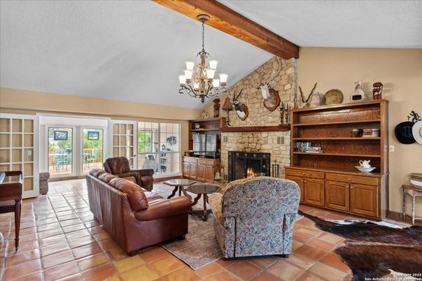 Chandelier, Fireplace, Interior, Living room, Stone Walls, Wooden Beams