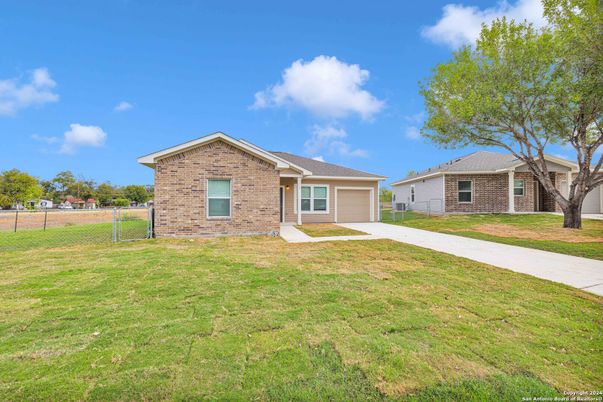 Attached, Backyard, Exterior, Facade, Brick Facade, Ranch