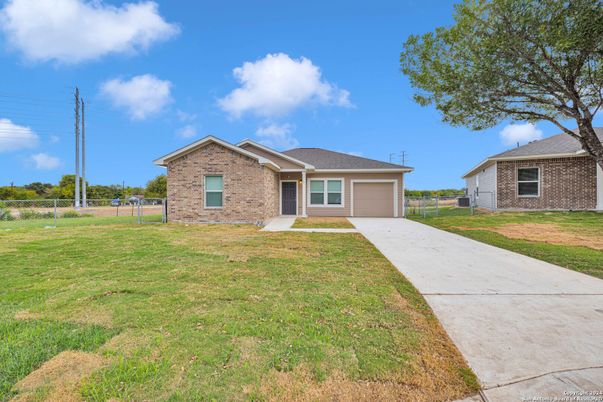 Attached, Backyard, Exterior, Facade, Brick Facade, Ranch