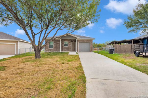 Attached, Backyard, Exterior, Facade, Brick Facade, Ranch